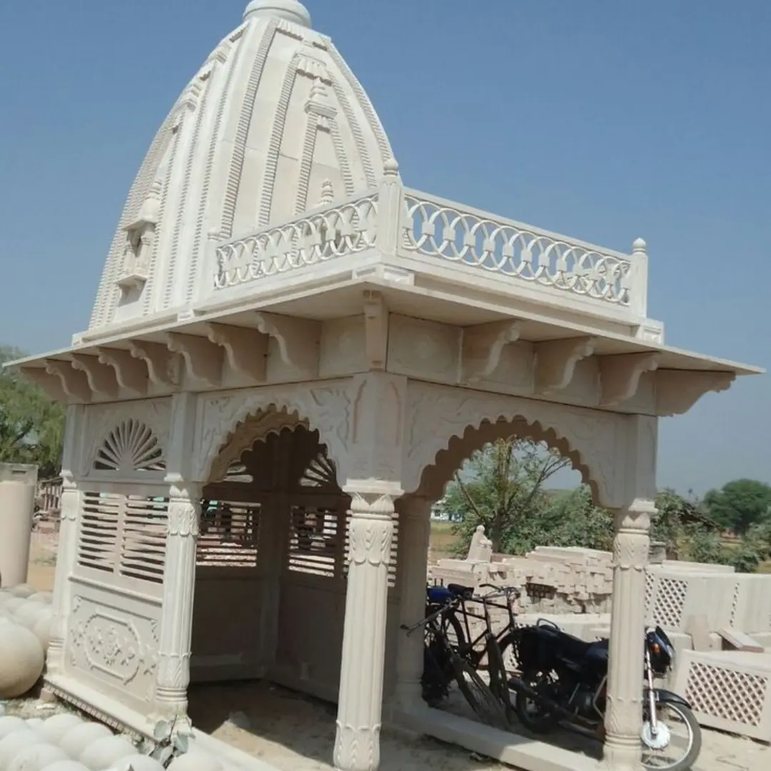 Outdoor marble Hindu temple with gold leaf detailing