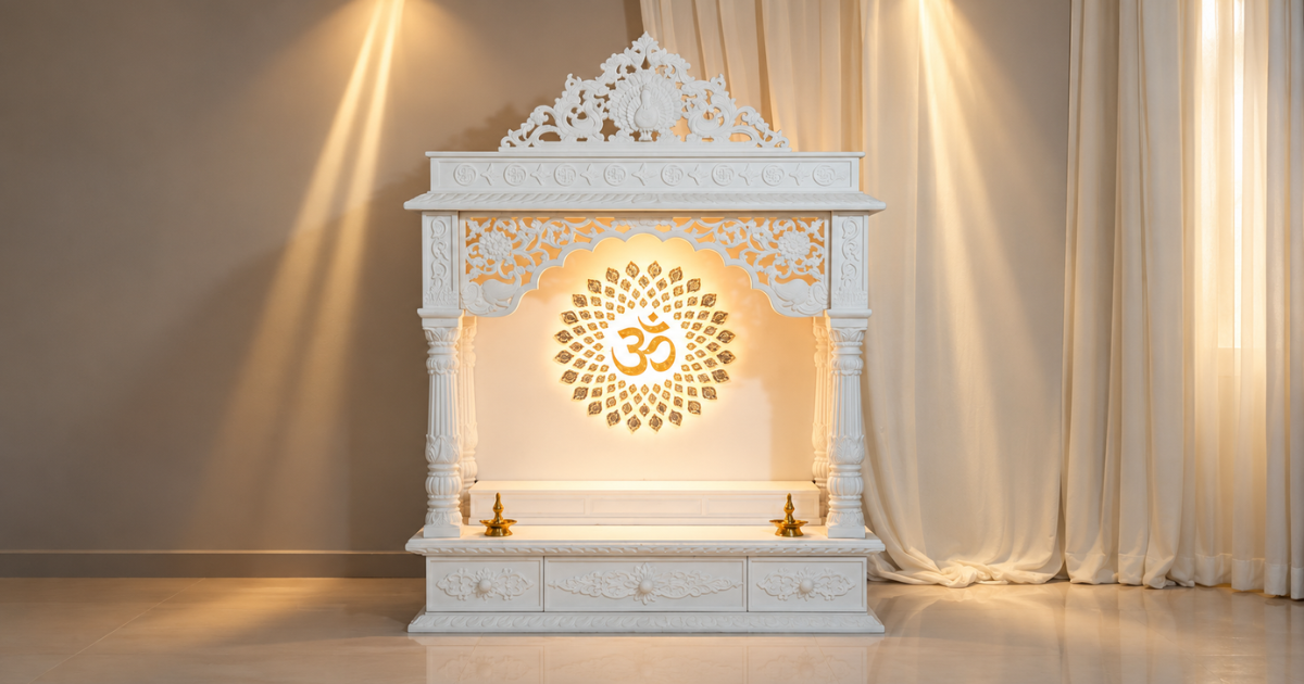 White marble small temple design for home with golden Om symbol and intricate carvings