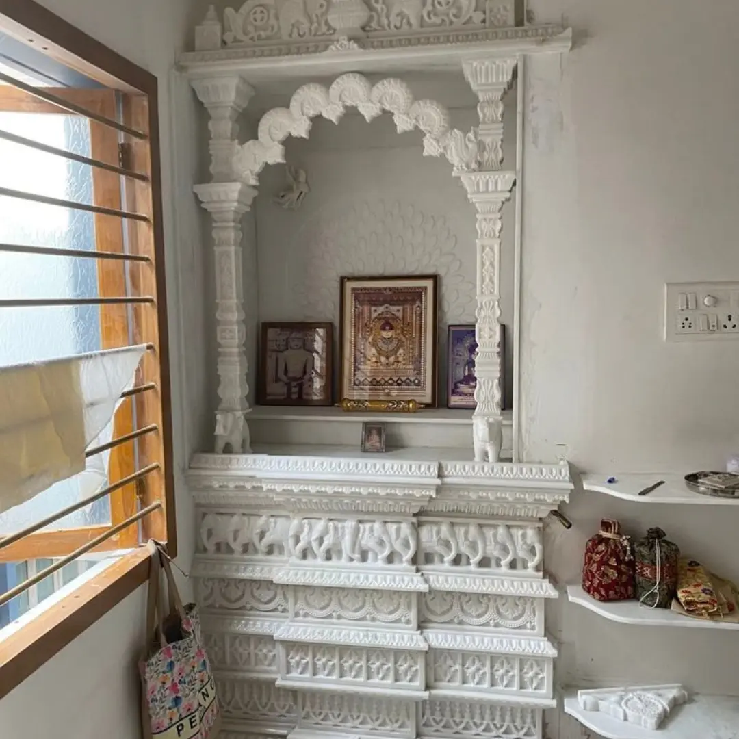 Corner marble mandir for home in white marble with a dome