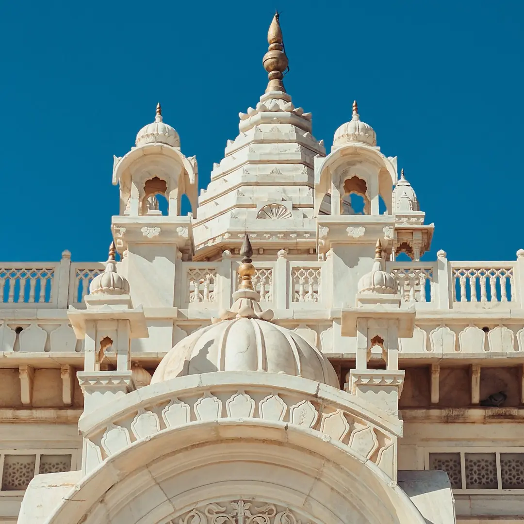 Marble Sikh temple with carved pillars and arches